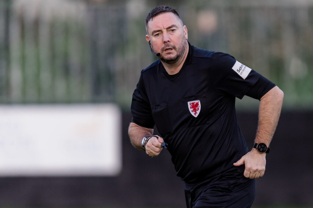 Match referee Nicholas Pratt  during the JD Cymru Premier League fixture between Caernarfon Town F.C & Peybont F.C at The Oval Stadium, Caernarfon, Wales, 5th November, Wales