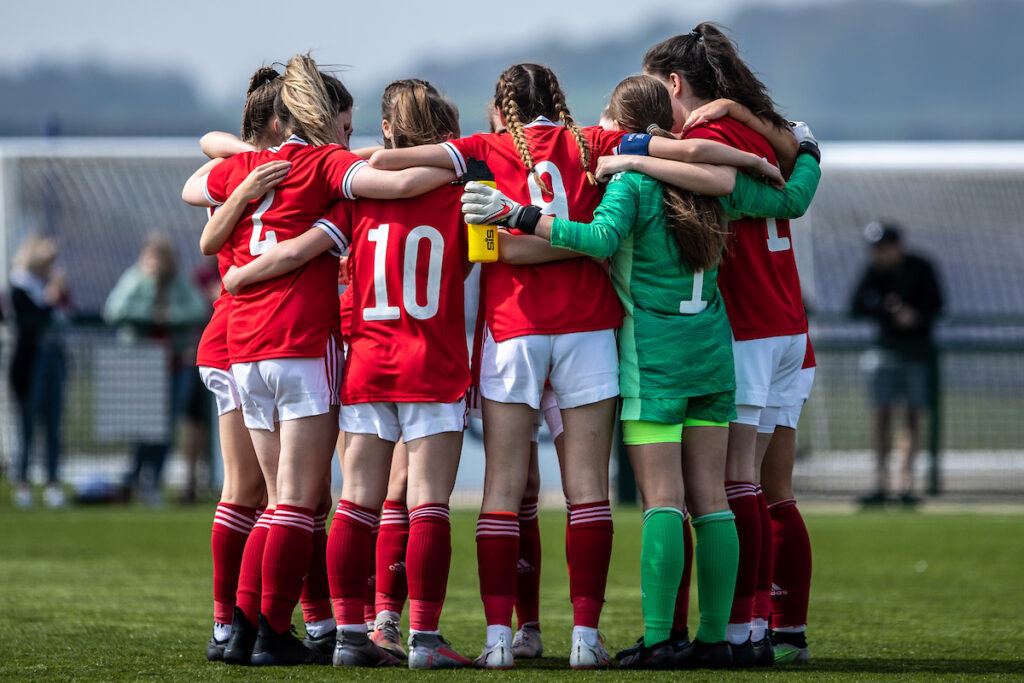 Cymru team huddle during the UEFA Development Tournament fixture between Cymru U16 Girls and Finland U16 Girls at Hollingsworth Bros Stadium, Broughton, Wales