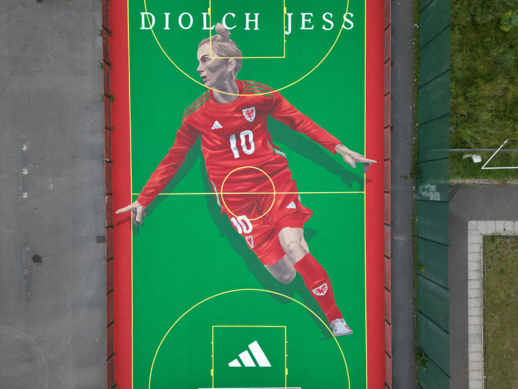 A general view of a pitch-sized mural of Cymru legend Jess Fishlock